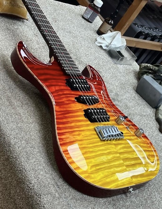 Custom electric guitar with flame maple sunburst top